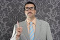 Nerd retro businessman raising finger up