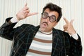 Nerd silly crazy myopic glasses man funny gesture Royalty Free Stock Photo