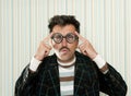 Nerd silly crazy myopic glasses man funny gesture Royalty Free Stock Photo