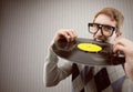 Student angry, biting a vinyl record Royalty Free Stock Photo