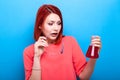 Nerd wearing laboratory glasses holding a red liquid tube in her Royalty Free Stock Photo