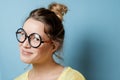 Nerd young woman on a blue background. Studio shot Royalty Free Stock Photo