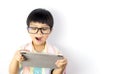 Nerdy boy is surprising on what on the tablet Royalty Free Stock Photo