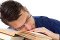 Nerdy geek fall asleep on books Royalty Free Stock Photo