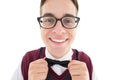 Nerdy hipster fixing his bow tie Royalty Free Stock Photo