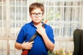 Nerdy kid with a toy gun