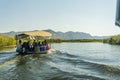 NERETVA, CROATIA, SEPTEMBER 30, 2017: boat safari with tourist on the neretva river delta , between tangerine tree and orange tree