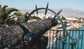 Nerja / Spain - October 2019: Close up view of a carved heavy old Spanish cannon at famous viewpoint Balcon de Europa. Popular