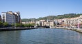 Nervion river in the center of Bilbao, with the town hall in the background in the Basque Country Royalty Free Stock Photo