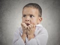 Nervous anxious stressed child boy biting fingernails Royalty Free Stock Photo