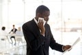 Nervous black male speaker reading paper preparing for public sp Royalty Free Stock Photo