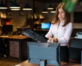 Nervous breakdown at work. Business woman freaks out and breaks the computer in the office