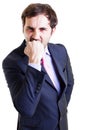 Nervous businessman biting his fist Royalty Free Stock Photo