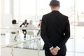 Nervous businessman waiting to enter at business meeting rear view Royalty Free Stock Photo