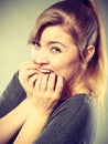 Nervous girl biting nails. Royalty Free Stock Photo