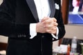 Nervous groom in tuxedo waiting the bride in wedding day