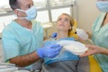 Nervous lady in dentist`s chair