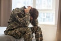 Nervous male military suffering depression, sitting alone at home, PTSD concept. Royalty Free Stock Photo