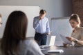 Nervous male speaker worried to make presentation in public