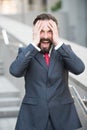Nervous manager losing his temper while keeping hands on his head Royalty Free Stock Photo
