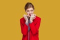 Nervous stressed woman biting her fingernails, looking away, being worried and depressed. Royalty Free Stock Photo