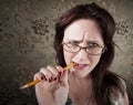 Nervous Woman Chewing on a Pencil Royalty Free Stock Photo