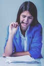 Nervous woman working with documents psychological portrait, aggression, anger, frustration