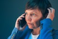 Nervous worried businesswoman during unpleasant telephone conversation Royalty Free Stock Photo