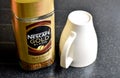 Nescafe Gold Blend instant coffee and cup Royalty Free Stock Photo