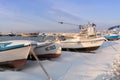 Nesebar, Bulgaria - January 12, 2017: Ships and boats covered in snow in the port of the old town Nessebar on the bulgarian Black