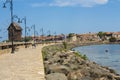 NESEBAR, BULGARIA - JUNE 07, 2019: windmill and road to old historical centre of the town Nesebar, UNESCO World heritage