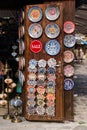 Nesebar, Bulgaria-08.15.2018: Traditional bulgarian ceramic plates and dishes on wall in the street market. Colorful clay Royalty Free Stock Photo