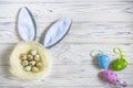 A nest with colored Easter eggs and bunny ears at home on Easter Royalty Free Stock Photo