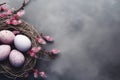 Nest with Easter eggs and a sprig with pink flowers on gray background, copy space. AI generated