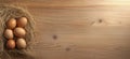 Nest with eggs on wooden surface, six brown eggs arranged in straw, natural setting, warm lighting, copy space for text Royalty Free Stock Photo