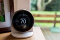 Nest smart thermostat on a table at living room