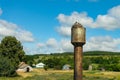 Nest stork on the old water tower. Against the sky. Royalty Free Stock Photo