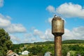 Nest stork on the old water tower. Against the sky. Royalty Free Stock Photo