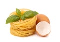 Fresh egg pasta nest with basil and eggshells Royalty Free Stock Photo