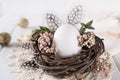 Nest with white chicken egg. Easter concept. Happy Easter or spring card