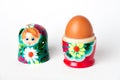 Matryoshka inside which lies a chicken egg Royalty Free Stock Photo