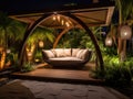 Evening oasis: contemporary gazebo with mood lighting and greenery Royalty Free Stock Photo