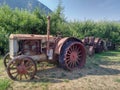 Old Rusted vintage tractor in a field