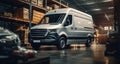 A white van is parked inside a warehouse, Online order delivery Royalty Free Stock Photo