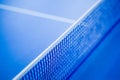 Net on blue ping pong table Royalty Free Stock Photo