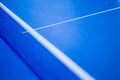 Net on blue ping pong table Royalty Free Stock Photo