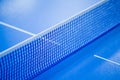 Net on blue ping pong table Royalty Free Stock Photo