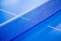 Net on blue ping pong table Royalty Free Stock Photo