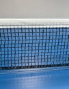 Net on a blue tennis table Royalty Free Stock Photo