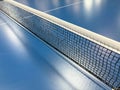 Net on a blue tennis table Royalty Free Stock Photo